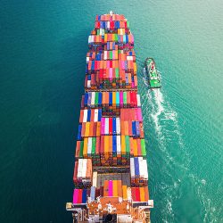 Container ship in export and import business and logistics. Aerial view